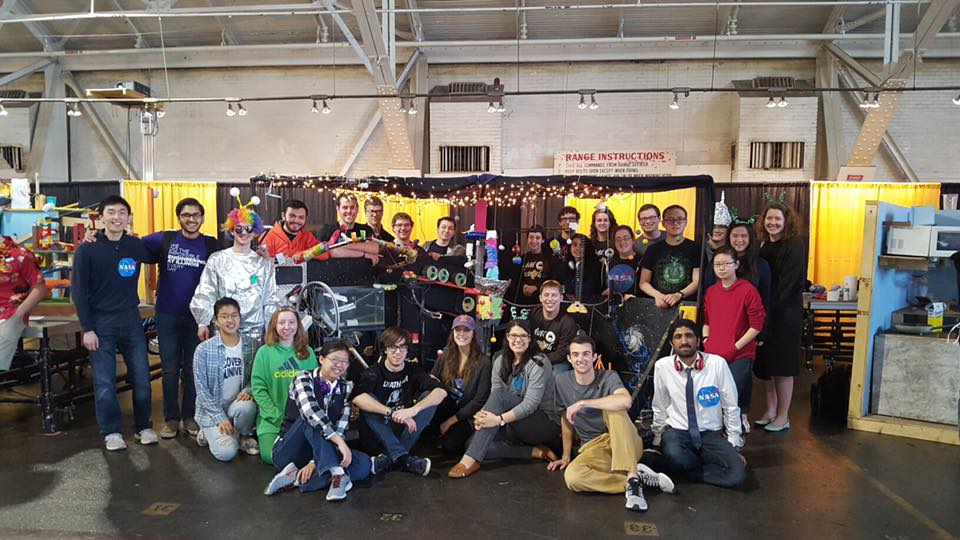 Rube Goldberg Society posing with one of their creations