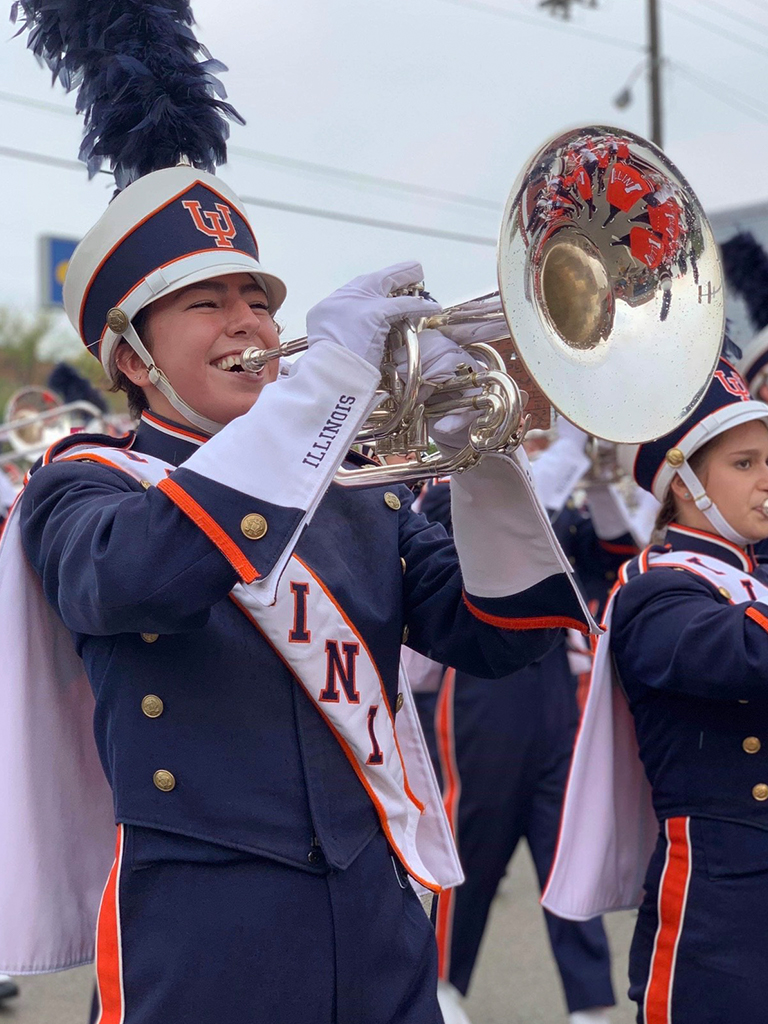 Raquel playing a mellophone in Marching Illini.