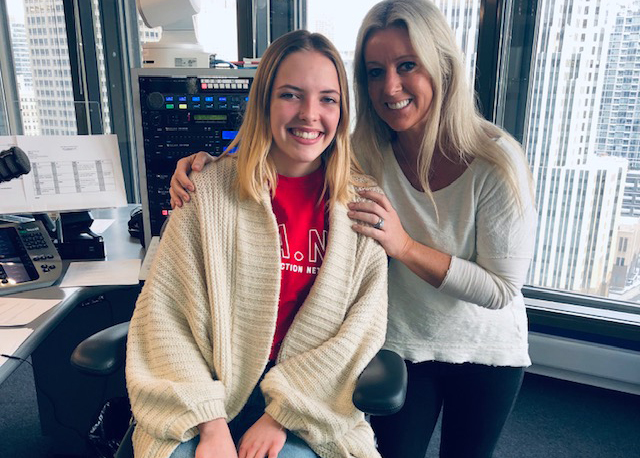 Abbey taking a picture with a radio host after being interviewed.  