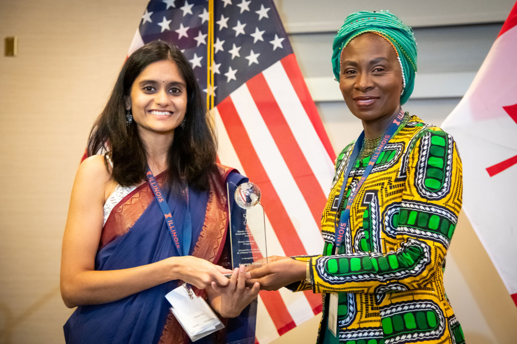 Ananya receiving an award for her work with SwaTaleem.